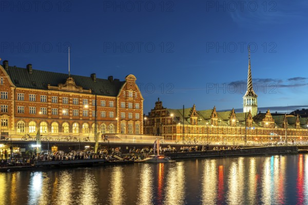 The former stock exchange Børsen and C.F. Tietgens Hus on Holmens Canal at dusk, Copenhagen, Denmark, Europe