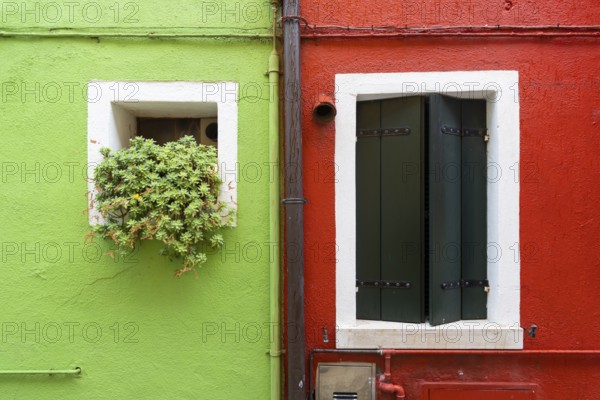 City view of Burano with colourfully painted houses and canals. Burano, Venice, Veneto, Italy, Europe