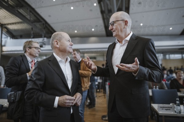 Olaf Scholz (SPD), Federal Chancellor, together with Dietmar Woidke (SPD), Minister President of the State of Brandenburg, taken at the Brandenburg SPD state representatives' meeting in Potsdam, 14 December 2024