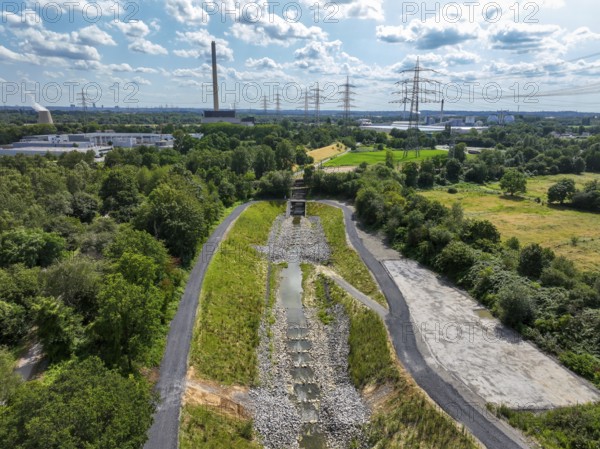 Bottrop, North Rhine-Westphalia, Germany, Renaturalised Boye, the tributary of the Emscher, was transformed into a near-natural watercourse, flood protection through newly designed flooding areas, the Boye is now free of sewage after the construction of a parallel sewer, is part of the Emscher river system and thus part of the Emscher conversion, was previously an open, above-ground wastewater channel, mixed water channel with surface water and wastewater, Europe
