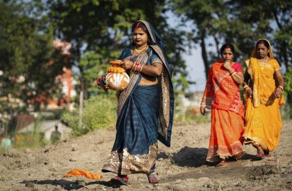 Hindu devotees perform rituals as they offer prayers to the Sun god in the bank of Brahmaputra river on the occasion of the 'Chhath Puja' festival in Guwahati, Assam, India on 7 November 2024. Chhath Puja is a significant Hindu festival celebrated primarily in the Indian states of Bihar, Jharkhand, Uttar Pradesh, and in Nepal. Dedicated to the worship of the Sun God (Surya) and his wife Usha (also referred to as Chhathi Maiya), this festival seeks blessings for prosperity, health, and longevity