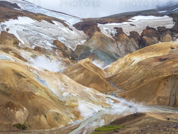 Steaming hot springs and colourful rhyolite mountains, Hveradalir geothermal area, Kerlingarfjöll, Icelandic highlands, Iceland, Europe