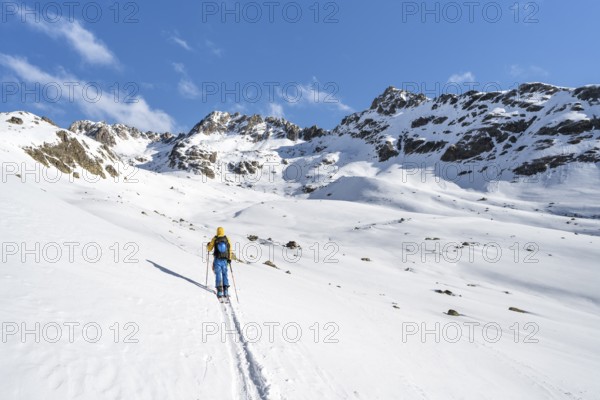 Ski tourers in a wintry mountain landscape, Bündner Haute Route ski tour, Albula Alps, Rhaetian Alps, Grisons, Eastern Switzerland, Switzerland, Europe