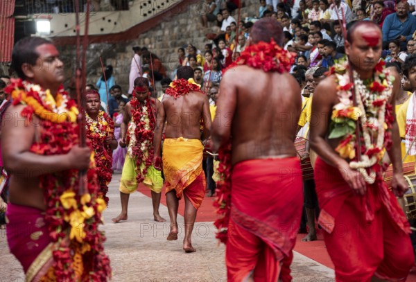 GUWAHATI, INDIA, AUGUST 19: Priests dance in the beat of Dhol (Drum) during the annual three-day-long Deodhani festival at the Kamakhya Temple on August 19, 2024 in Guwahati, India. The Deodhani festival is dedicated to Serpent Goddess Kamakhya, people believed that Goddess Kamakhya fulfills the wishes of the devotees who participate in this festival