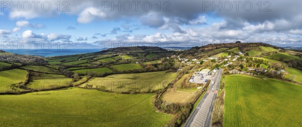 Farms over Morcombelake Village from a drone, Bridport, Dorset, England, United Kingdom, Europe