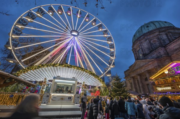Ferris wheel at the winter village, Christmas market at dusk, St Elisabeth's Church on the right, Jakobsplatz, Nuremberg, Middle Franconia, Bavaria, Germany, Europe