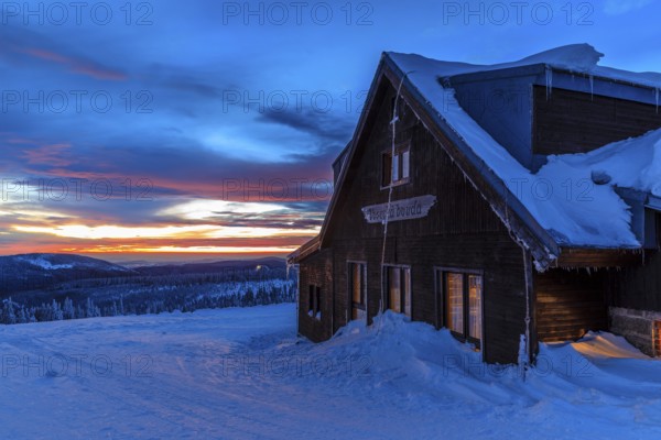 Wossecker Baude at dusk on a winter's day, Harrachsdorf in the Giant Mountains, Czech Republic, Europe