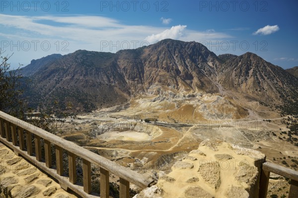 Viewpoint overlooking vast volcanic landscape and majestic mountains under sunny skies, volcanism, volcanic island, Nikia viewpoint, Nisyros, Dodecanese, Greek Islands, Greece, Europe