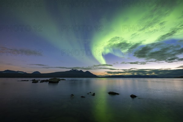 Northern Lights over Lake Akkajaure and Akka mountain range, Stora Sjöfallet National Park, Laponia, Norrbotten, Lapland, Sweden, Europe