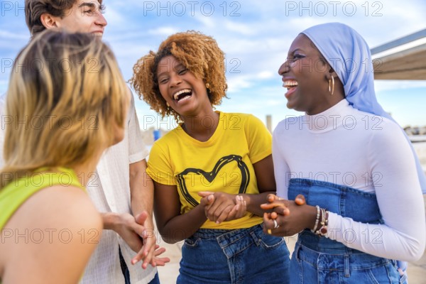 Young and smiling african woman talking to friends in a happy conversation outdoors