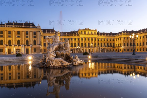 Fountain in the courtyard of honour at Schönbrunn Palace at dusk, UNESCO World Heritage Site in Vienna, Austria, Europe