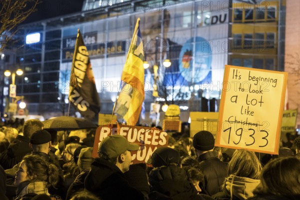 Participants in the demonstration under the slogan Brandmauer statt Brandstifter / Asylrecht verteidigen in front of the Konrad-Adenauer-Haus, the party headquarters of the CDU, after a joint vote by the CDU/CSU and AfD in favour of a stricter migration policy introduced by party chairman Friedrich Merz. Berlin, 30.01.2025