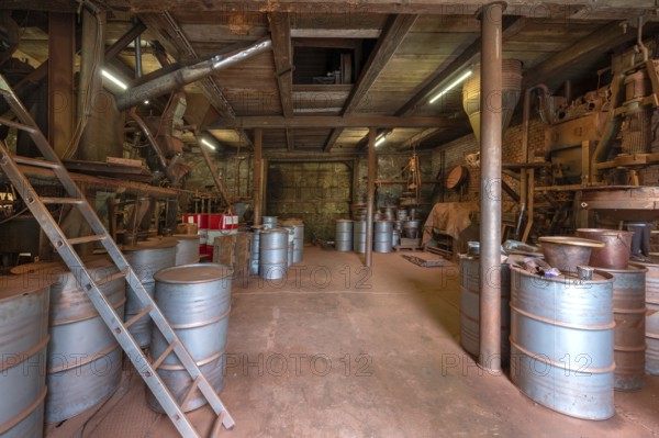Metal drums for bronze powder from a metal powder mill, founded in 1900, Igensdorf, Upper Franconia, Bavaria, Germany, Europe