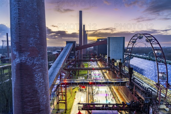 The ice rink at the Zollverein coking plant, UNESCO World Heritage Zollverein Coal Mine Industrial Complex, 150 metres long, against the backdrop of the coke ovens, formerly the largest coking plant in the world, Essen, North Rhine-Westphalia, Germany, Europe