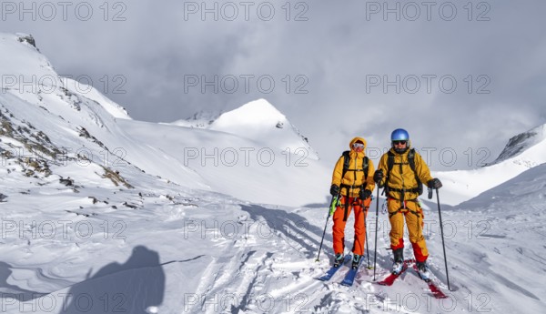 Ski tourer, Snowy mountain landscape, Bernese Alps, Bernese Oberland, Switzerland, Europe