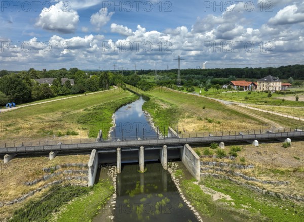 Dortmund / Castrop-Rauxel, North Rhine-Westphalia, Germany, renaturalisation of the Emscher, flood retention basin HRB Mengede. A new floodplain landscape for flood protection and biodiversity is being created at the Emscher-Auen farm. The Emscher, which is currently straightened, will be given curves again and can meander through its new floodplain. The Emscher has been completely free of sewage since 2022 following the construction of a parallel sewer. The river was previously an open, above-ground combined sewer with rainwater and wastewater, Europe
