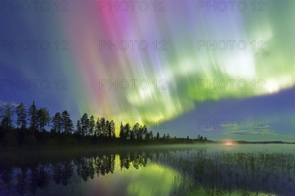 Northern Lights, Aurora borealis, polar lights, weather phenomenon showing natural light display over lake in autumn, Dalarna, Sweden, Scandinavia, Europe
