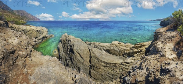 Dramatic rock formations overlooking turquoise waters, hiking trail from Avlona to Diafani, Avlona, Diafani, Karpathos, Greece, Europe