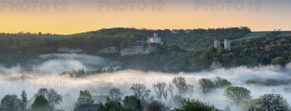 Landscape with the castle ruins Rudelsburg and Saaleck and manor Kreipitzsch, sunrise, morning fog in the Saale valley, near Bad Kösen, Burgenlandkreis, Saxony-Anhalt, Germany, Europe