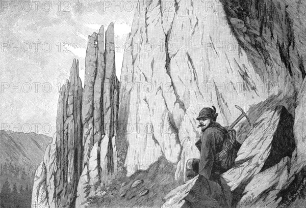 The ascent of the Totenkirchl, a 2190 m high mountain in the Wilder Kaiser in the Northern Limestone Alps east of Kufstein in Tyrol, Austria, reproduction of an original, around 1900, historical, A mountaineer sits on rocks and looks at an impressive rock formation, Europe