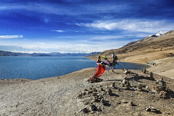 Buddhist prayer flags lungta at Himalayan lake Tso Moriri, Korzok, Ladakh, India, Asia