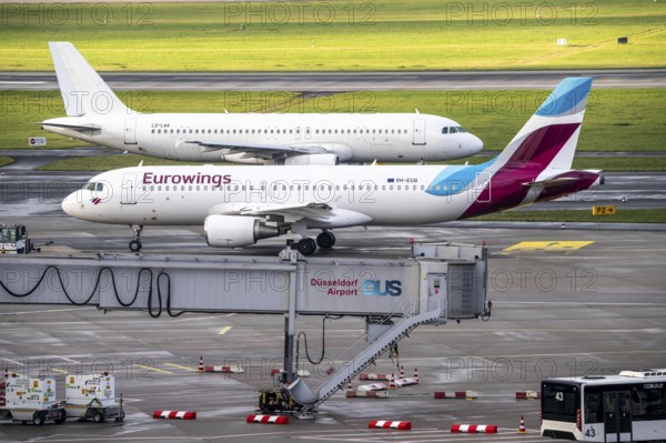 Düsseldorf Airport, Eurowings Airbus on the way to take-off, on the apron, European Air Charter Airbus A320-231 on the taxiway to take-off, Düsseldorf, North Rhine-Westphalia, Germany, Europe