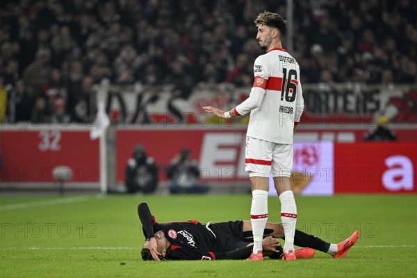 Atakan Karazor VfB Stuttgart (16) with Hugo Ekitike Eintracht Frankfurt SGE (11) injured Injury MHPArena, MHP Arena Stuttgart, Baden-Württemberg, Germany, Europe
