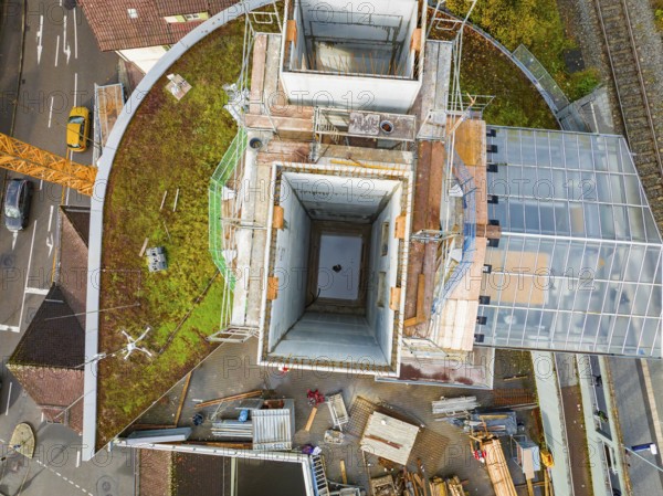 Roof shot of a construction site with various building materials and structures, ZOB Calw reconstruction for Hermann Hessebahn, Calw, Black Forest, Germany, Europe