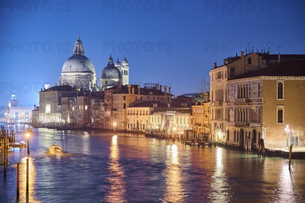 View on 'Canal Grande' at 'Ponte dell'Accademia' bridge to 'Basilica di Santa Maria della Salute' in Venice by night in winter, Italy, Europe