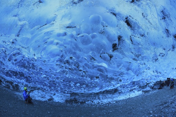 Tourist inside an ice cave, glacier cave, Vatnajökull, Iceland, Europe