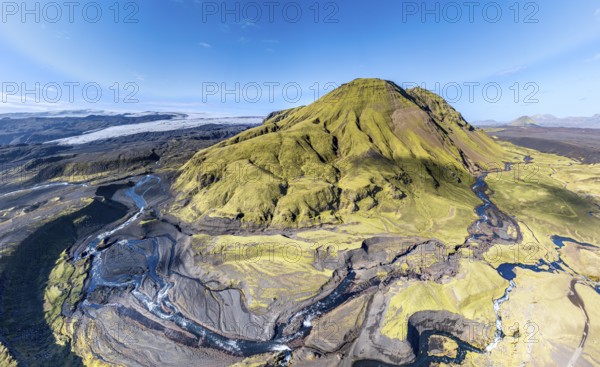 River along road F232 Öldufellsleid, slopes of Mt. Öldufell, moss-covered hill in black lava sand, aerial view, Iceland, Europe