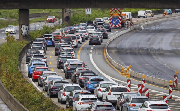 Duisburg, North Rhine-Westphalia, Germany, traffic jam on the A40 motorway at the Kaiserberg junction. The busy area with the A40 and A3 motorways has been undergoing renovation and expansion for years. There are always closures or restrictions for motorists there, Europe