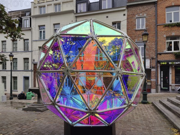 Marollescenece, art installation, title Dichroic Moon, object with a dichroic foil coating, Rue de l'Épée, Brussels, Belgium, Europe