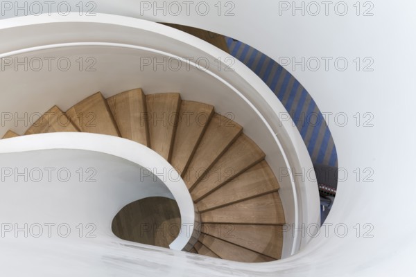 Modern spiral staircase in Vitra Haus, wooden steps, architects Herzog & de Meuron, Vitra Campus, Weil am Rhein, Baden-Württemberg, Germany, Europe
