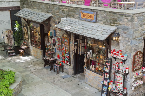 Inviting souvenir shop with various decorations and souvenirs on a stone facade, Makrinitsa, Balcony of Pelion, Municipality of Volos, Pelion Mountains, Thessaly, Greece, Europe
