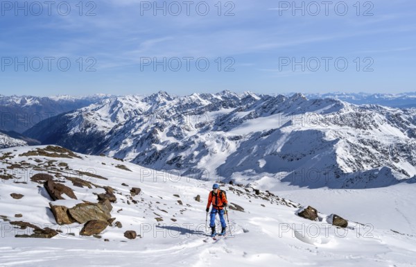 Ski tourers on a high tour on the Fürkeleferner glacier, view of the mountain panorama, snow-covered mountain landscape in winter, ascent to Monte Cevedale, Ortler Alps, Vinschgau Valley, Italy, Europe