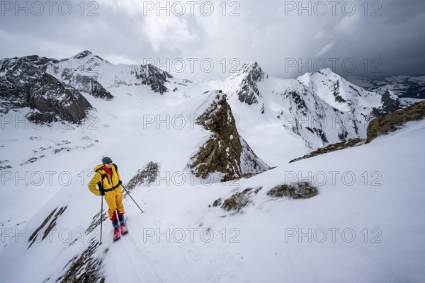 Ski tourers ascending from the Iffigtal to the Wildhornhütte, snow-covered mountain landscape, Bernese Alps, Bernese Oberland, Switzerland, Europe