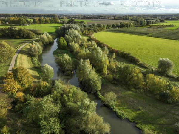 Bergkamen, Ruhr area, North Rhine-Westphalia, Germany, autumn landscape on the Seseke. The renaturalised Seseke, a tributary of the Lippe, has been transformed into a near-natural watercourse, flood protection and biodiversity through newly designed floodplains. Following the construction of a parallel sewer, the Seseke is now free of wastewater, having previously been an open, above-ground wastewater sewer, combined sewer with surface water and wastewater. Theme photo: EU Nature Conservation Act. The EU Nature Conservation Act obliges member states to implement measures to restore nature on at least 20 per cent of the EU's land and sea areas by 2030, Europe