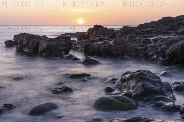 Sunset on the coast at Kenidjack Valley. Long exposure. St Just, Penzance, Cornwall, England, Great Britain