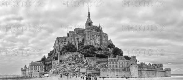 Black and white images of the island of Mont Saint-Michel with its imposing monastery and walls, Le Mont-Saint-Michel