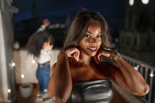 Close-up portrait of a sensual latin woman in a night party with friends