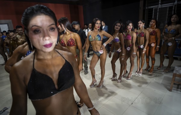 Female bodybuilders wait backstage to compete the 4th Ms Saraighat all India classic body building championship on March 23, 2025 in Guwahati, India, Asia