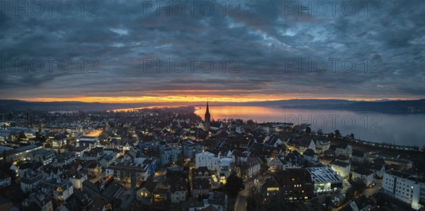 Aerial view, panorama of an atmospheric sunrise over the town of Radolfzell on Lake Constance with the cathedral tower, district of Constance, Baden-Württemberg, Germany, Europe