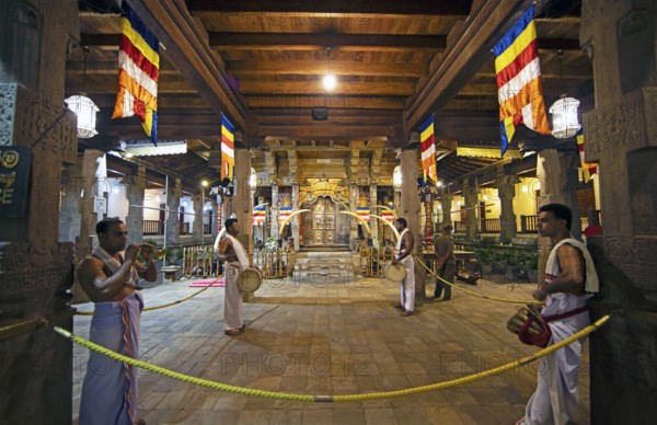 Drummers and flute players at a shrine in the Buddhist Temple of the Tooth or Sri Dalada Maligawa, Kandy, Central Province, Sri Lanka, Asia