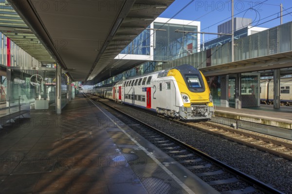 Passenger train at empty platform in the Gent-Sint-Pieters railway station in Ghent during public transportation strike, East Flanders, Belgium, Europe