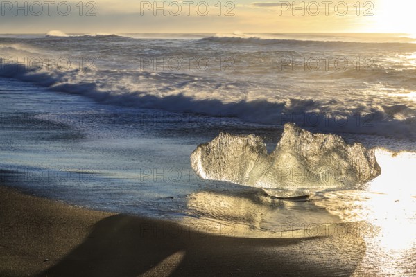 Ice floes on the beach, waves, sunny, morning mood, winter, Diamond Beach, Breidamerkursandur, Jökulsarlon, Iceland, Europe