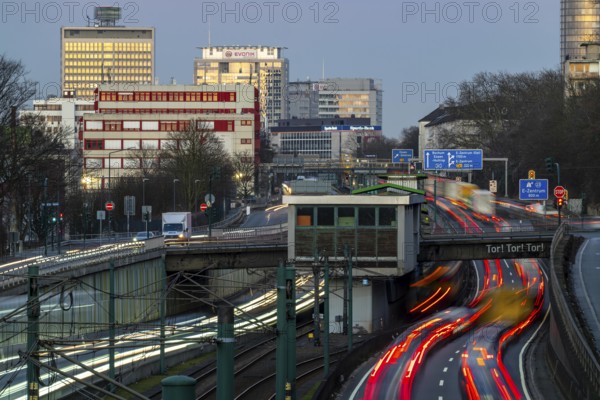 Motorway A40, Ruhr expressway, heavy traffic jam, rush hour, city passage in Essen, skyline of the city centre, underground line between the lanes, Hobeisenbrücke stop, North Rhine-Westphalia, Germany, Europe