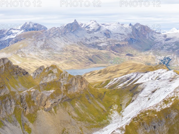 Expansive mountain landscape with snow-capped peaks, valleys and a small lake in the background, Alpentower, Switzerland, Europe