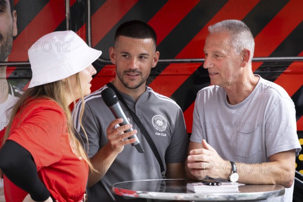 Former Bundesliga player and German international Ralf Falkenmayer is interviewed about EURO 2024 in Frankfurt's Fan Zone. Falkenmayer played a total of 385 games in the Bundesliga for Eintracht Frankfurt and Bayer 04 Leverkusen from 1981 to 1996, scoring 37 goals. He won the DFB Cup with Eintracht in the 1980-81 season and the UEFA Cup with Bayer Leverkusen in the 1987-88 season. He played four international matches for the national team from 1984 to 1986
