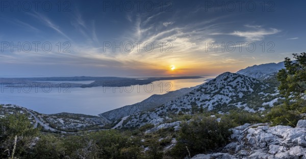 Majestic mountain landscape with sea at sunset and evening sky, pass road, Pag, Zadar, Croatia, Europe